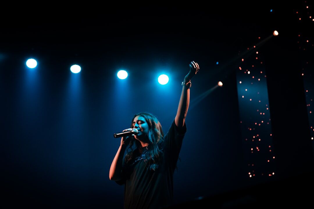 woman singing on stage