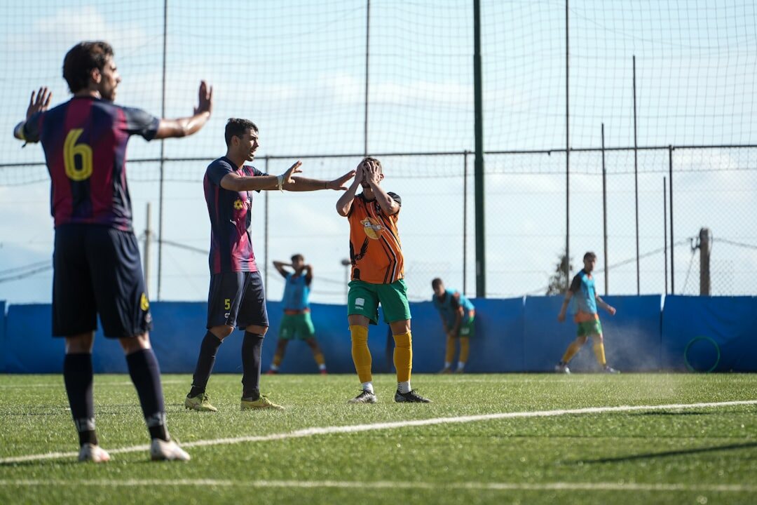 Football player celebrating a goal on the field